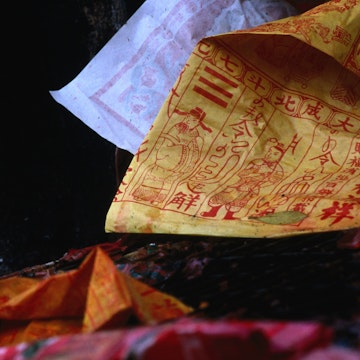 A soggy wet prayer hangs from the enchanted Lam Tsuen Wishing Tree in Tai Po.