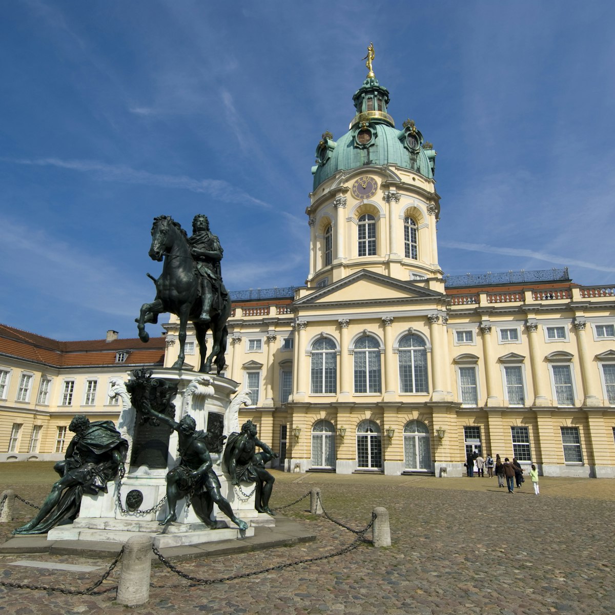 Statue of the Great Elector Frederick William of Brandenburg standing in grand courtyard of Charlottenburg Palace.