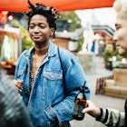 A stylish group of friends chatting and drinking together on a night out at an open air nightclub.
870195404
Friends drinking outside in Berlin