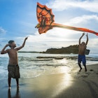 Kids playing with a kite at Tabanan village, Bali