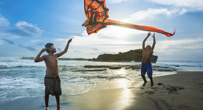 Kids playing with a kite at Tabanan village, Bali