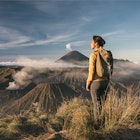 woman standing infront of mount bromo - stock photo
asia, indonesia, java, asian woman standing infront of mount bromo and mount semeru, admiring the view at sunrise