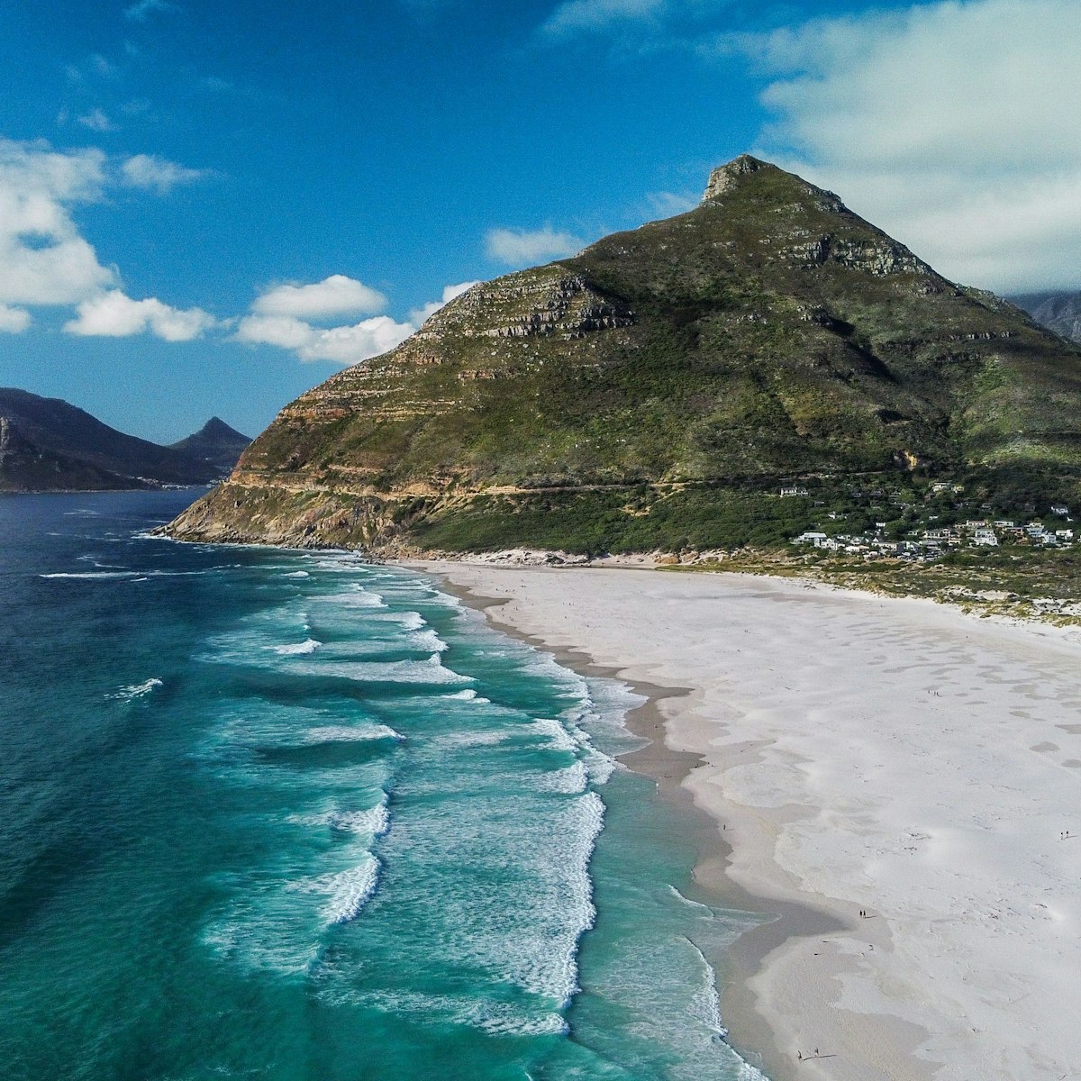 An aerial view of the beautiful Noordhoek Beach and Chapmans Peak in South Africa during summer
1445654367
chapmans peak, coastal, landscape, beautiful, vacation, coast, scenic, background, waves, seaside, outdoor, natural, aerial, top, skies