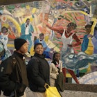 People walk by a mural on 125t Street, Harlem.
25401-26
DO NOT USE,  architecture,  art,  backpack,  building,  city,  commerce,  creativity,  culture,  day,  female,  girl,  girls,  harlem,  ideas,  lifestyles,  male,  man,  men,  multi-coloured,  mural,  outdoors,  painting,  people,  shopping,  sidewalk,  travel,  urban,  walk,  woman,  women,  New York,  North America,  United States,  arts culture and entertainment,  built structure,  casual clothing,  city life,  elementary age,  famous place,  female likeness,  human representation,  local landmark,  part of,  shopping bag,  side view,  three people,  three quarter length,  urban living,  urban scene,  visual art,  young adult,  young man,  young men,  young woman,  young women,  Adult,  Art,  Bag,  Bride,  Coat,  Face,  Female,  Handbag,  Head,  Male,  Man,  Mural,  Painting,  Person,  Shoe,  Woman