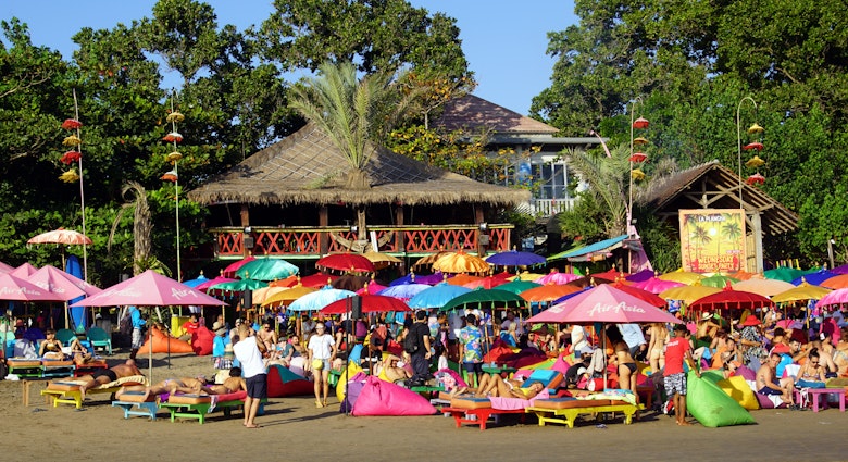 August 14, 2018: A crowd of people under colourful umbrellas outside La Plancha Beach Bar & Restaurant.
1159268683
asia, bali, building, busy, colorful, crowd, famous, kuta, outdoor, people, seminyak, tourism, vacation, beach, kuta beach, indonesia, tourist, holiday, asian, fun, travel, beach party, party, summer, summertime, tourists, sun, bathing, sunbathing, celebration, festival