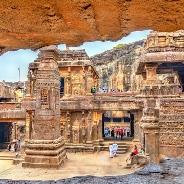 Visitors explore the Kailasa Temple (Cave 16) inside the Ellora Caves complex.