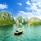 A boat among the karsts at Halong Bay in Vietnam, as seen from Ti Top island.